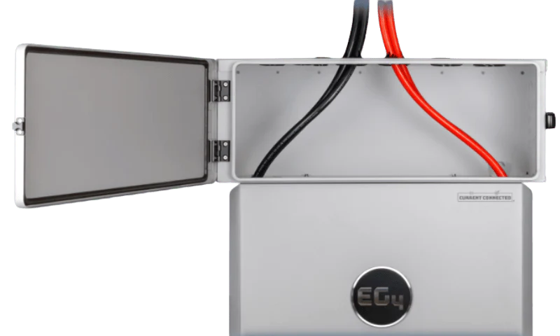 The powerpro conduit box being used on top of an eg4 inverter. It shows the box is open and displays how positive and negative wires feed in between the inverter and the outside.