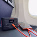 Jackery Explorer 100 Plus Portable Power Station powering phones on travels