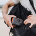 Jackery Explorer 100 Plus Portable Power Station displaying displaying its portability, easy to back for backpacks