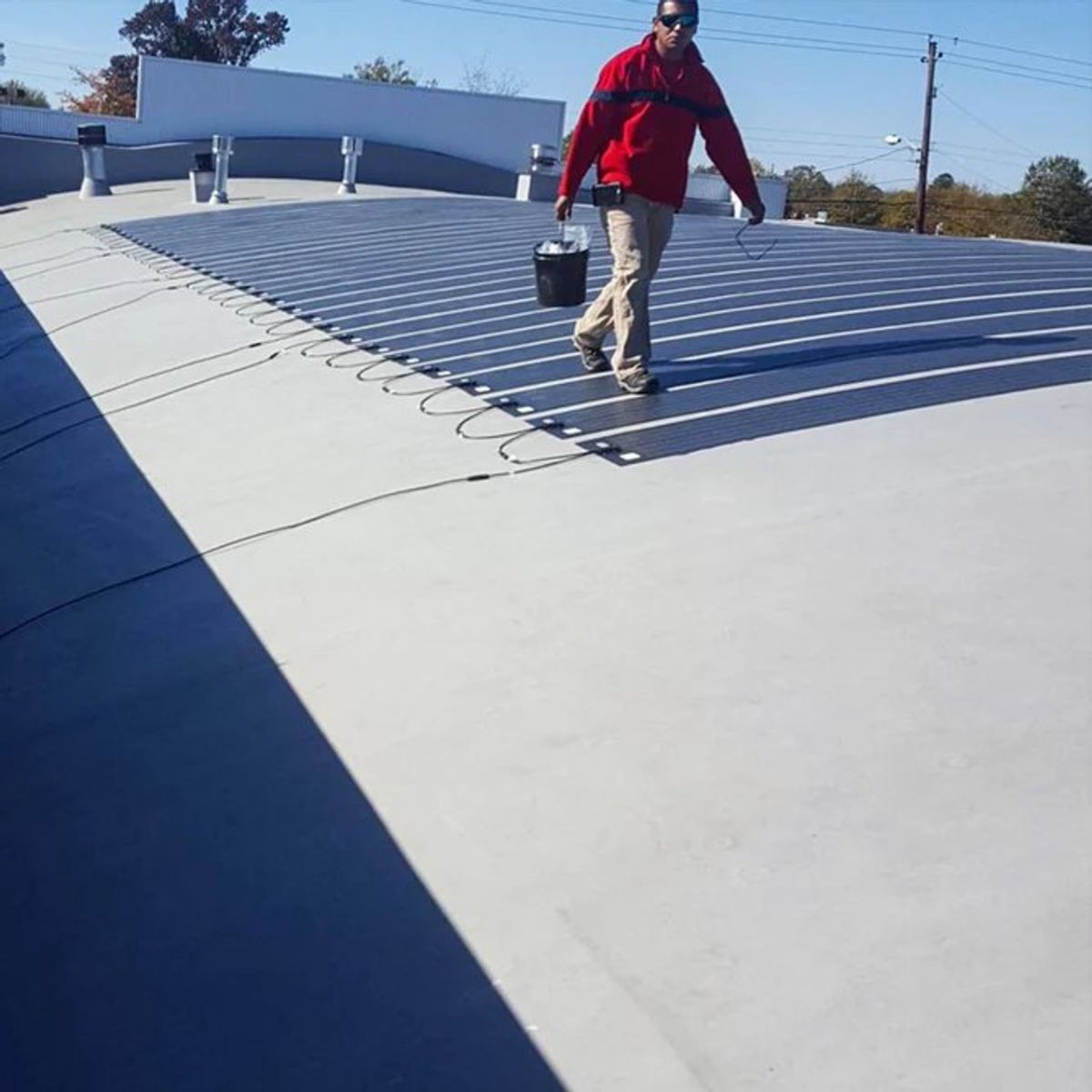 Rich Solar RS-F80C Mega 80W CIGS Flexible Solar Panel displaying its setup on curved surface roofs on buildings